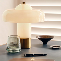 Soho Home Giovanni Table Lamp Cream. Crafted white domed glass. Aged brass details. Dimmable light.