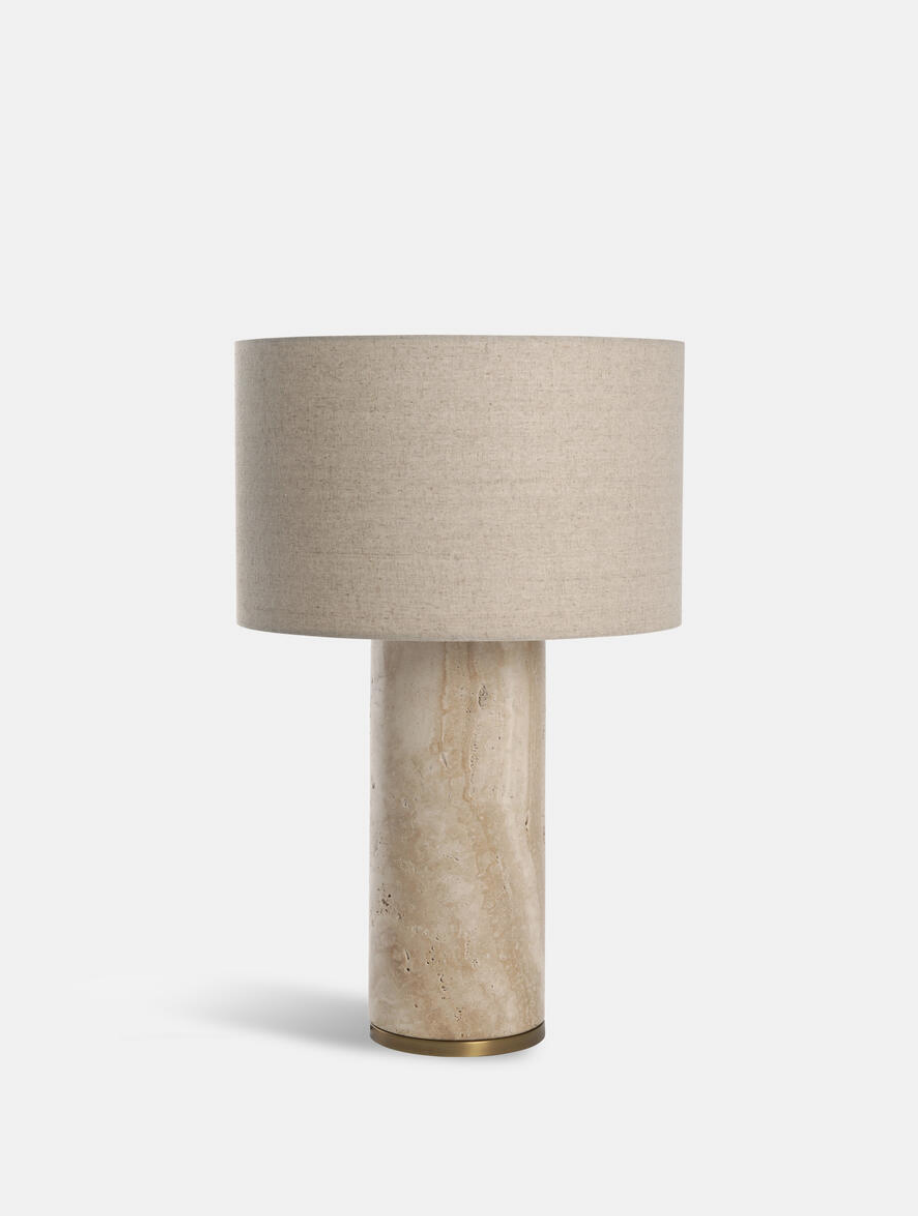 Remi Table Lamp, Large by Soho Home. Crafted from solid travertine, brass detailing and a natural linen shade. Inspired by Soho House.