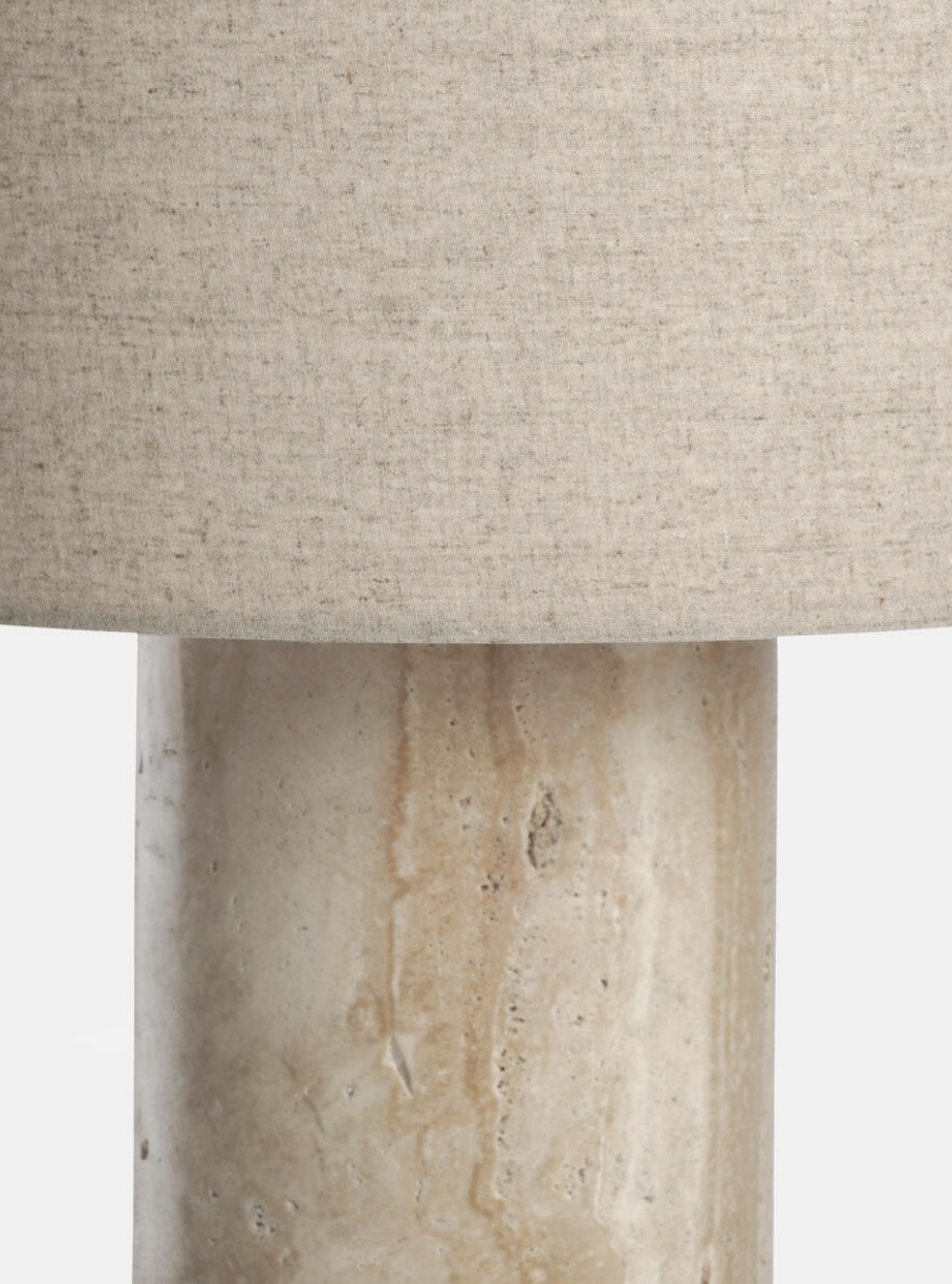 Remi Table Lamp, Large by Soho Home. Crafted from solid travertine, brass detailing and a natural linen shade. Inspired by Soho House.