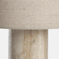 Remi Table Lamp, Large by Soho Home. Crafted from solid travertine, brass detailing and a natural linen shade. Inspired by Soho House.